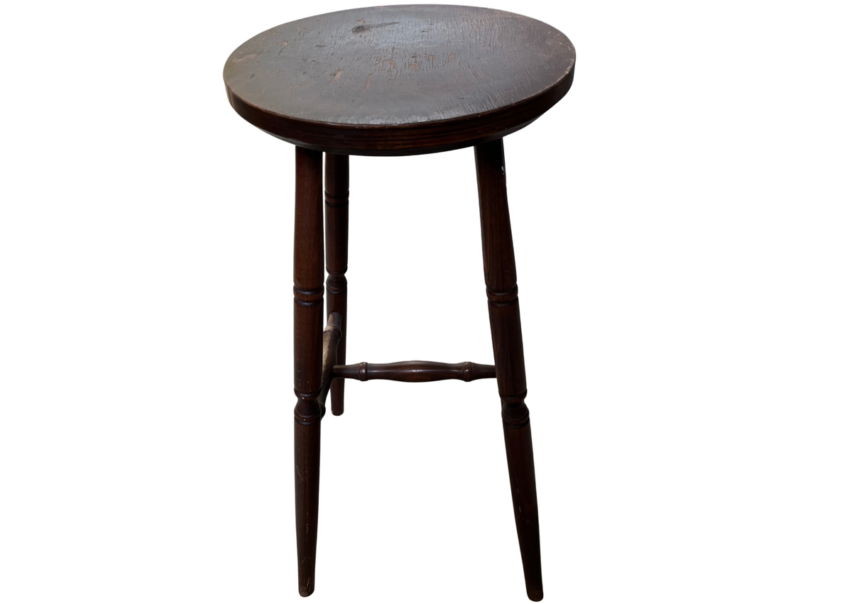 Tabouret haut en bois foncé à assise ronde