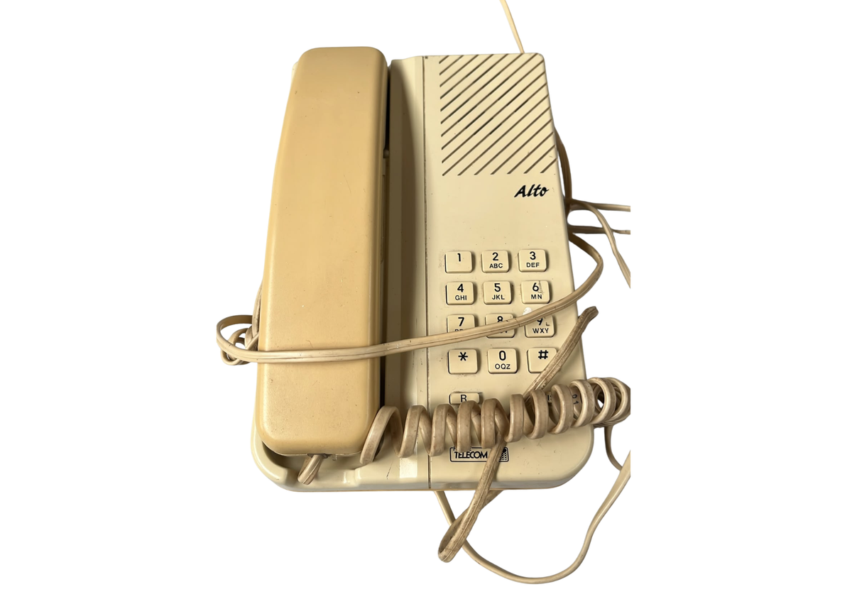 Téléphone fixe filaire beige des années 80